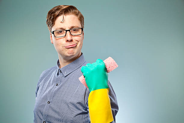 Nerdy guy getting ready to clean stock photo
