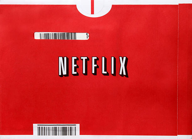 Netflix Kingston, New York, USA - October 27, 2011: A photograph of a Netflix mailer envelope.  With more than 25 million members worldwide, Netflix, Inc. is the world\'s leading Internet subscription service for movies and TV shows. Netflix members can have DVDs sent to them in the mail, or instantly watch movies and TV episodes streaming over the Internet to computers and TVs. dvd stock pictures, royalty-free photos & images