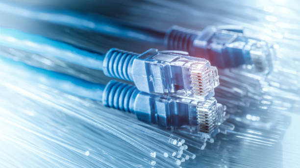 network cable with high tech technology fiber optical color background - fibra imagens e fotografias de stock
