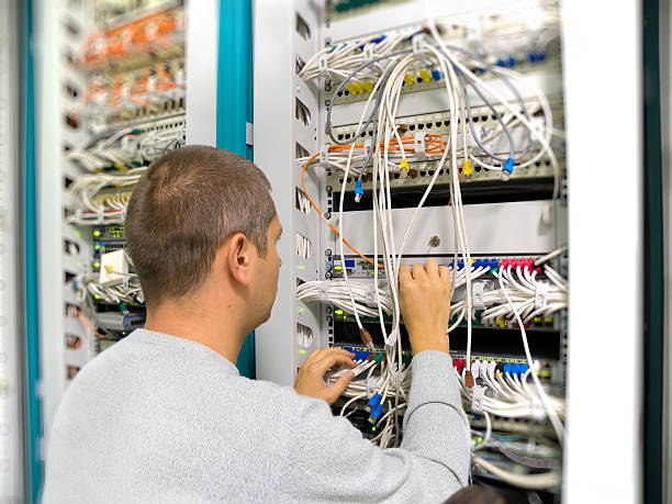 Network engineer solves a communication problem stock photo
