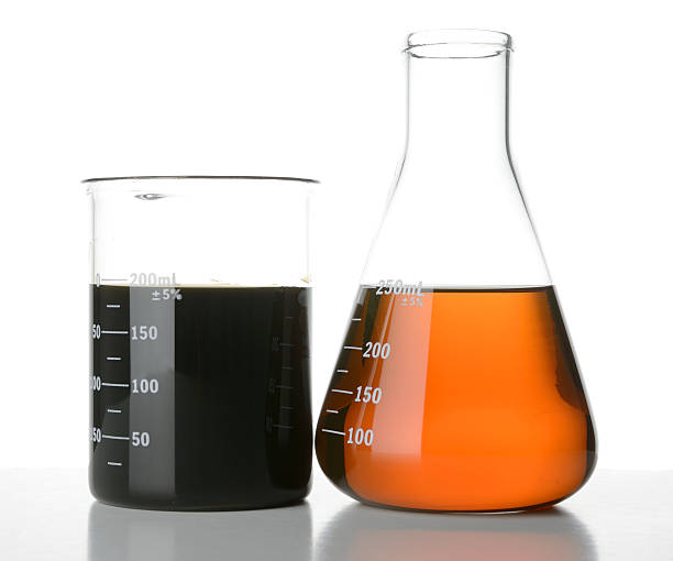 New and Used Motor Oil in Laboratory Glassware stock photo