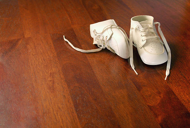 New Baby Shoes on Wood stock photo