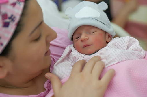 New born baby with his mother stock photo