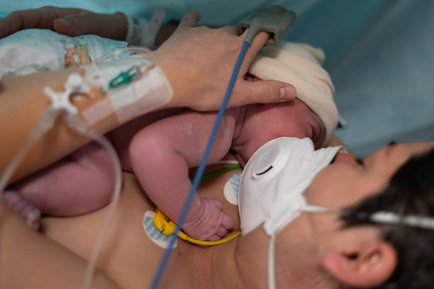 New born by caesarean section in Covid-19 stock photo