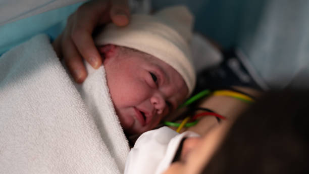 New born by caesarean section in Covid-19 stock photo