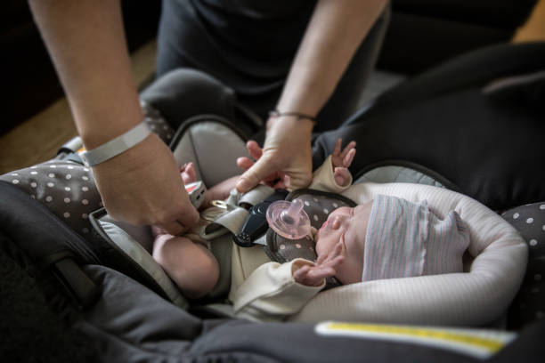 new born A newborn baby arriving home for the first time car safety seat stock pictures, royalty-free photos & images