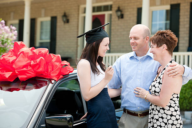 New Car A girl receives a new car from her parents. car loan stock pictures, royalty-free photos & images