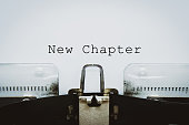 istock New Chapter words typed on a vintage typewriter. 1318375626