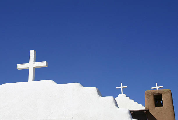 New Mexican adobe church with blue sky stock photo
