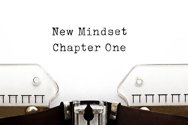 New Mindset Chapter One Typewriter New Mindset Chapter One printed on an old typewriter. attitude stock pictures, royalty-free photos & images
