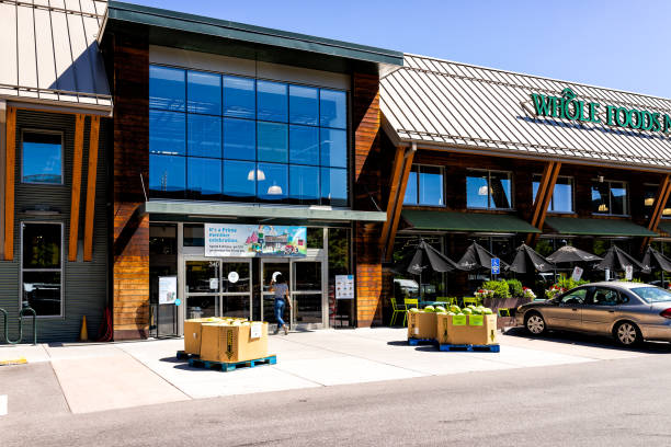 New modern large Whole Foods Market sign on exterior building in Aspen, Colorado entrance with prime banner Basalt, USA - July 10, 2019: New modern large Whole Foods Market sign on exterior building in Aspen, Colorado entrance with prime banner basalt stock pictures, royalty-free photos & images