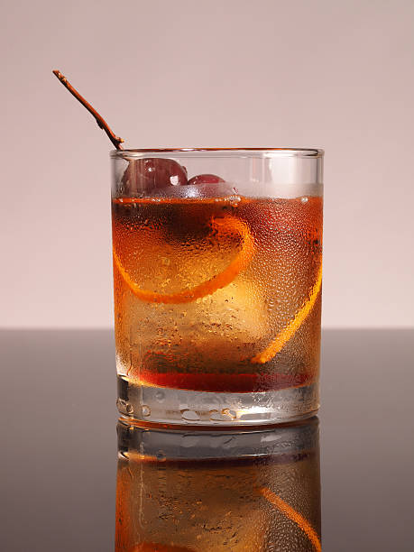 New Old Fashioned The new look being used for "Old Fashioned" cocktail. Bourbon soaked cherries, Orange peel and herb twig with fine whisky. manhattan cocktail stock pictures, royalty-free photos & images