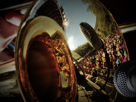 Crowd reflect in trombone New Orleans festival