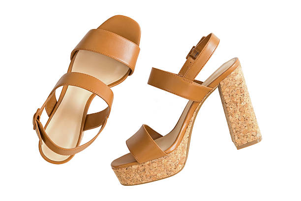 new pair of stylish brown high heels with cork soles - dames schoenen stockfoto's en -beelden