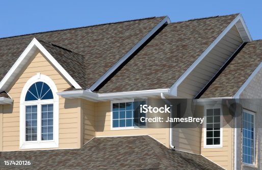 istock New Residential House; Architectural Asphalt Shingle Roof, Vinyl Siding, Gables 157420126