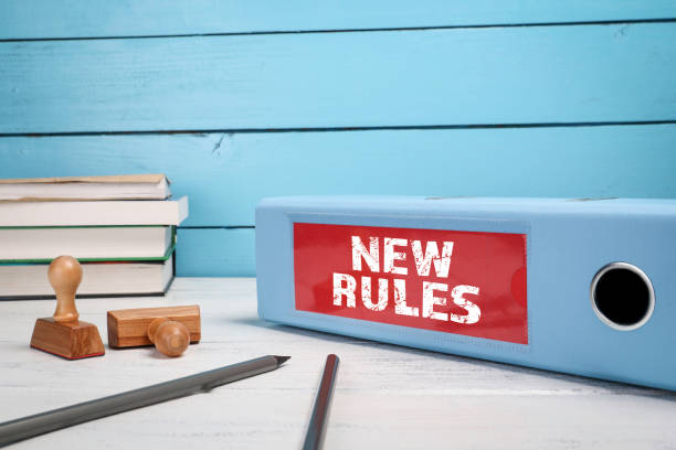 new rules. business concept. document folder on office desk - new standards bildbanksfoton och bilder