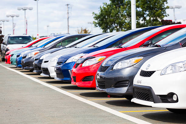 New Toyota Vehicles in a Row at Car Dealership stock photo