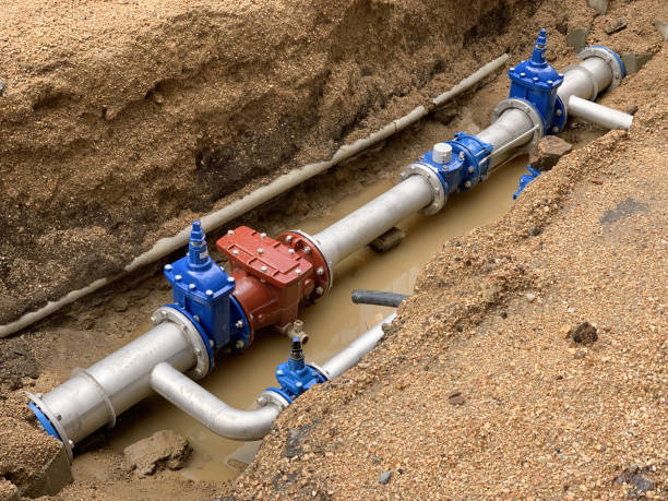 new water pipe in the ground image of new water pipe in the ground archaeology stock pictures, royalty-free photos & images