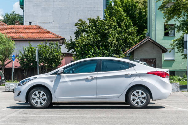 New white luxurious Hyundai Elantra limousine hatchback 2.0 Sport car parked on the parking lot in the city. stock photo