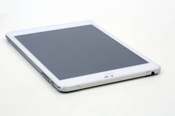 New white tablet on the table stock photo
