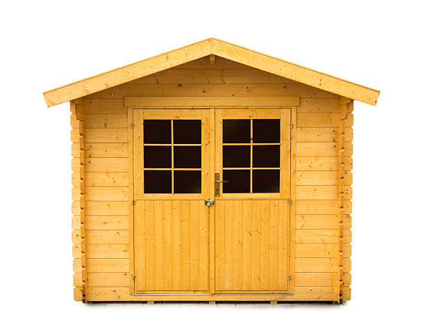 new Wooden Garden Shed isolated on white Close up of a new wooden garden shed on white background shed stock pictures, royalty-free photos & images