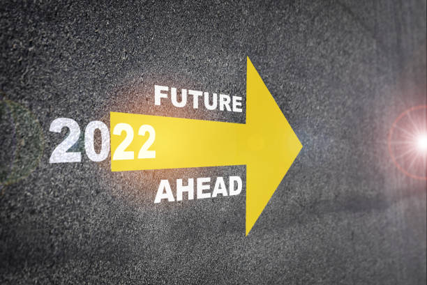 New year 2022 and future ahead word with yellow arrow on road surface stock photo