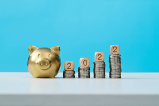 2022 new year and piggy bank on the table stock photo
