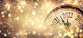 istock 2022 New Year - Clock And Fireworks - Countdown To Midnight  - Abstract Defocused Background 1351323612