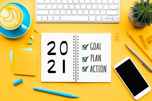2021 new year goal,plan,action text on notepad with office accessories.business management,inspiration concepts - future imagens e fotografias de stock