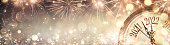 istock 2022 New Year - Golden Clock With Fireworks And Defocused Abstract Lights 1352511576