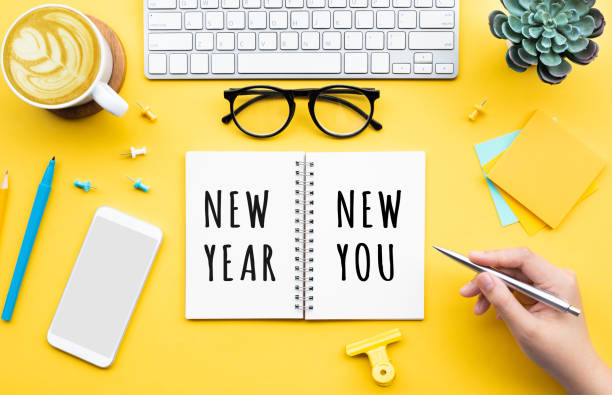 New year new you concepts with person writing text on notepaper stock photo