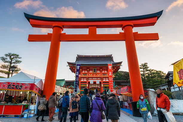 New Year's Day at Fushimi Inari Kyoto, Japan - January 1, 2015: Japanese people enter Fushimi Inari Shrine in the early morning of New Year's Day on January 1, 2015, in Kyoto, Japan. shrine stock pictures, royalty-free photos & images