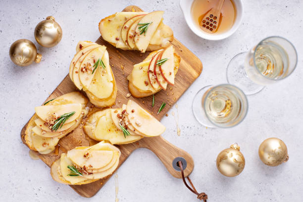 New Years Eve party appetizer, pear and brie crostini stock photo