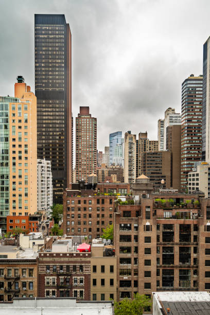 New York City midtown Manhattan skyline view with skyscrapers and cloudy sky in the day. stock photo