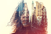 The profile of a woman's head, a New York City skyline double exposed with the image.  A conceptual depiction of smart cities, and the people who shape them.