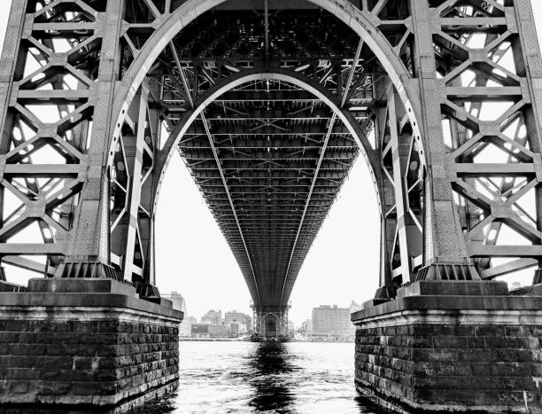 New York City Underneath the Williamsburg Bridge in Lower Manhattan. arch architectural feature photos stock pictures, royalty-free photos & images