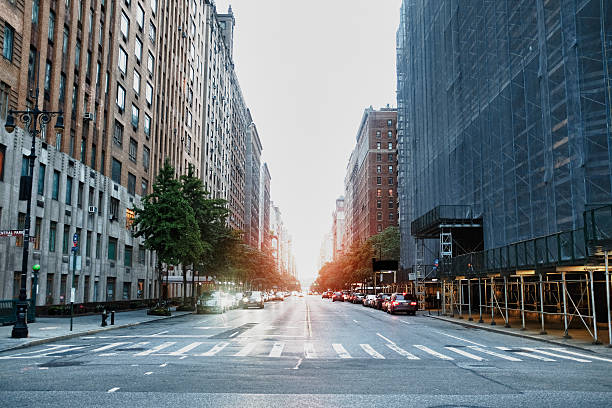New York City Street at sunset in manhattan, NYC urban road stock pictures, royalty-free photos & images