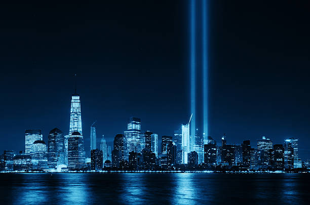 New York City skyline New York City downtown urban architecture at night and September 11 tribute light world trade center manhattan stock pictures, royalty-free photos & images