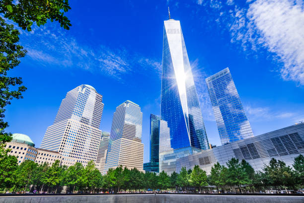 New York City, USA - Freedom Tower in Manhattan New York City, USA - Manhattan skyline with One World Trade Center Tower (aka Freedom Tower) 911 memorial stock pictures, royalty-free photos & images