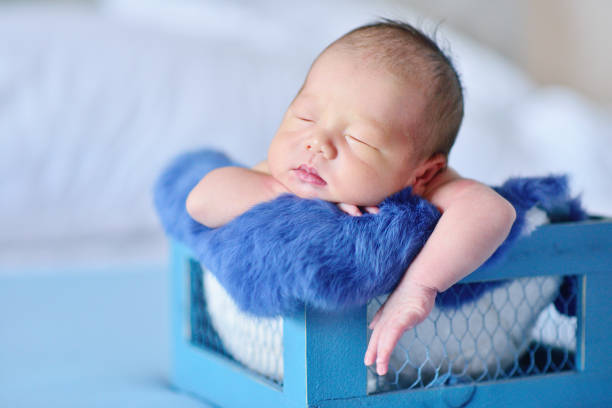 Newborn at Blue Background stock photo