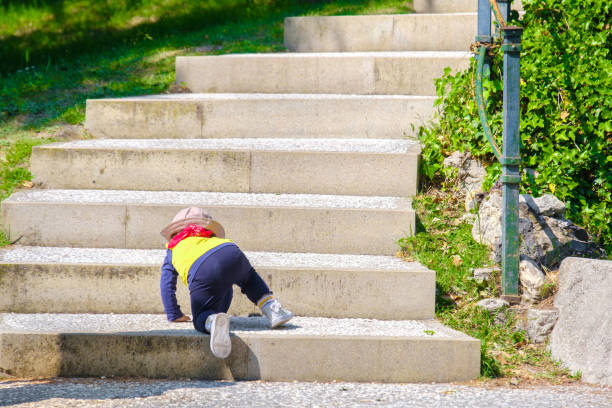 Newborn baby climb stairs Newborn baby climb stairs baby human age photos stock pictures, royalty-free photos & images