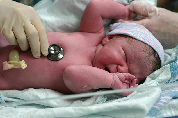 Newborn baby in hospital crying stock photo