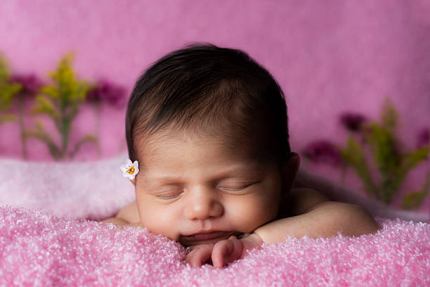 Newborn laying down stock photo