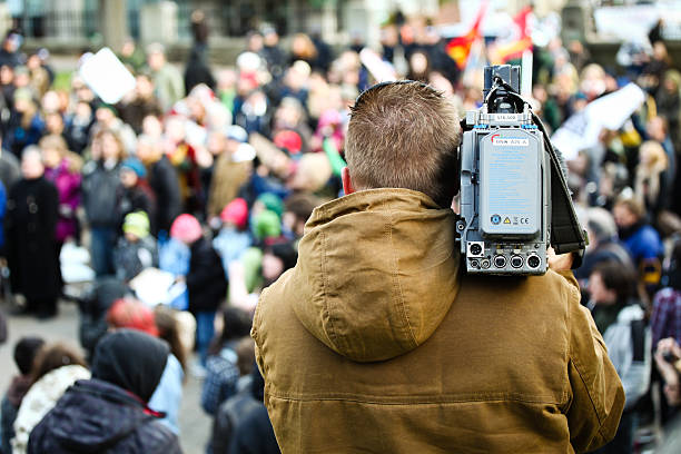 News Agency Camera Man Filming Protest stock photo