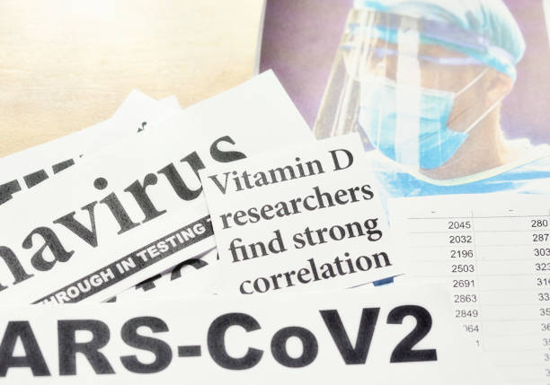 Newspaper headlines about role of Vitamin D in COVID-19 pandemic stock photo