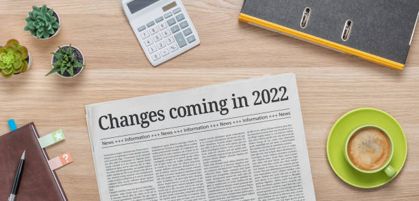 A newspaper on a desk with the headline Changes coming in 2022 stock photo