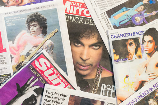 Edinburgh, UK - April 22, 2016: A selection of British newspapers featuring the musician Prince, following news of his death on April 21, 2016. Born in Minneapolis in 1958, Prince received widespread appreciation for his musical innovation and skill, as well as his commercial success. 