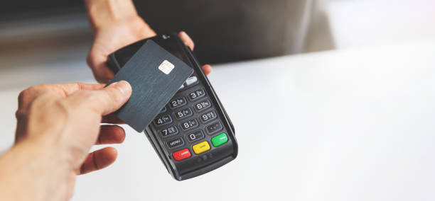 nfc contactless payment by credit card and pos terminal. copy space - credit card imagens e fotografias de stock