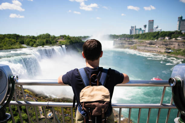 Niagara Falls are always attraction for tourists Enjoying beautiful view to Niagara Fall Niagara Falls stock pictures, royalty-free photos & images