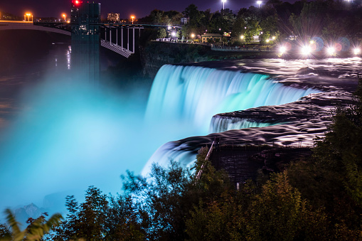 Niagara falls lit at night